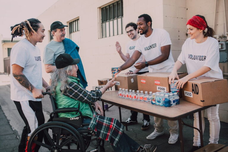 Volunteers distribute meals, bringing nourishment and smiles to individuals